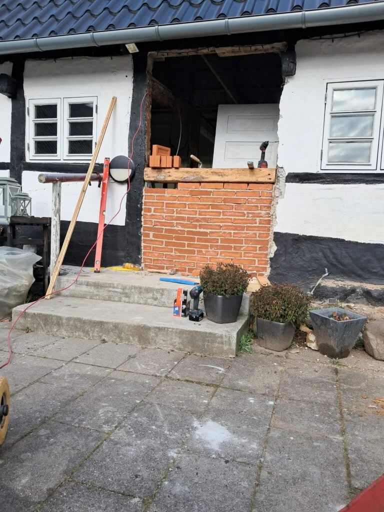 Brickwork repair in a timber framed facade in Copenhagen